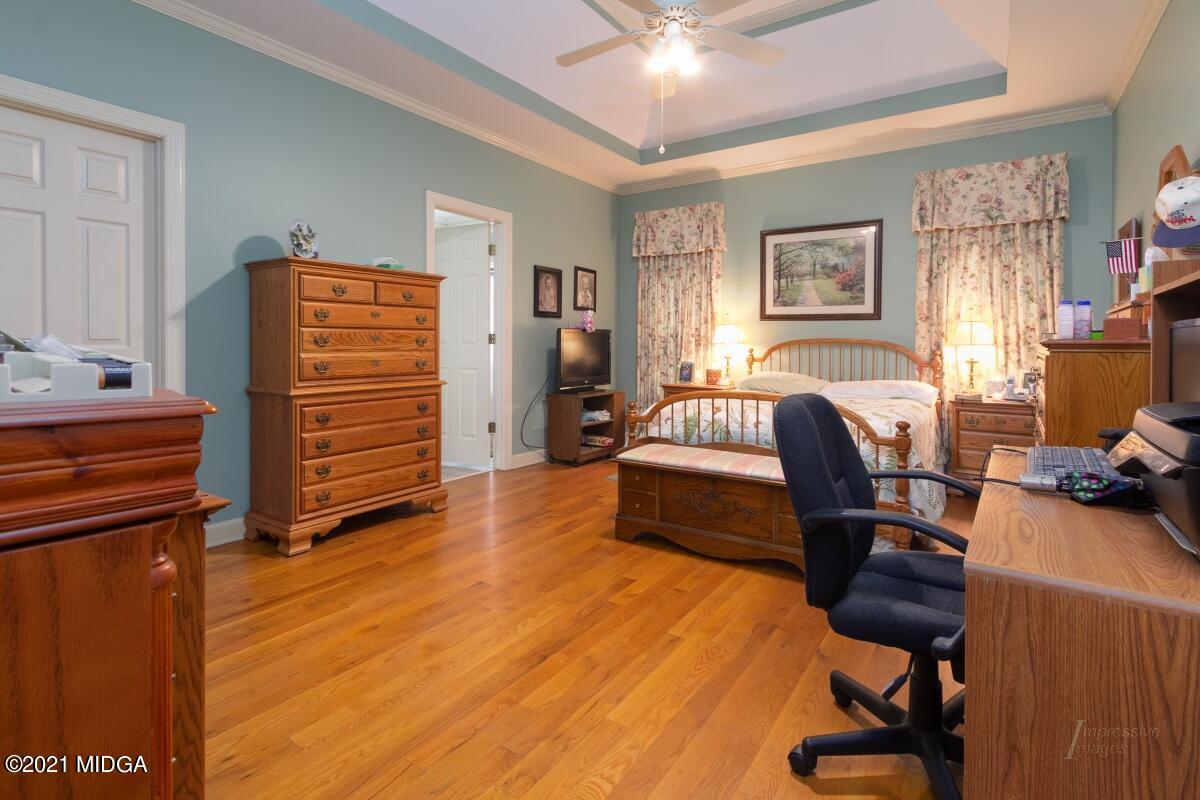 7471 Rivoli Road Macon, GA 31210 - Photo 12 of 26 a bedroom with furniture and a window