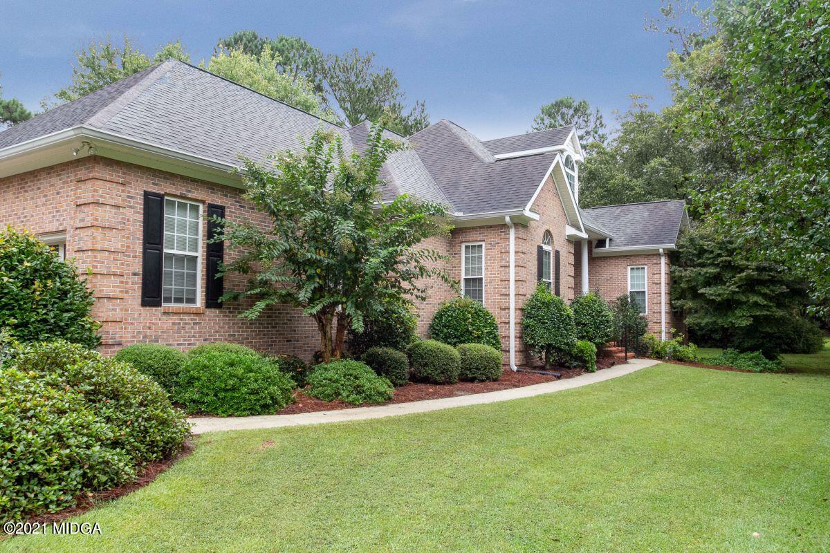 7471 Rivoli Road Macon, GA 31210 - Photo 3 of 26 a front view of a house with a yard and potted plants
