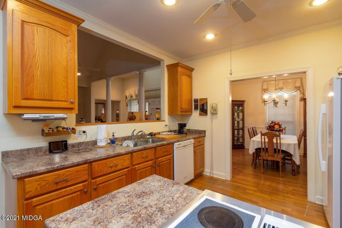 7471 Rivoli Road Macon, GA 31210 - Photo 7 of 26 a very nice looking kitchen with a large counter space appliances and cabinets