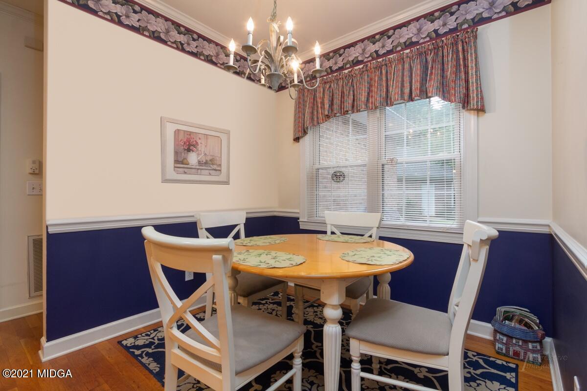 7471 Rivoli Road Macon, GA 31210 - Photo 8 of 26 a view of a dining room with furniture and chandelier