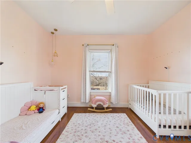 a room with toys and baby crib