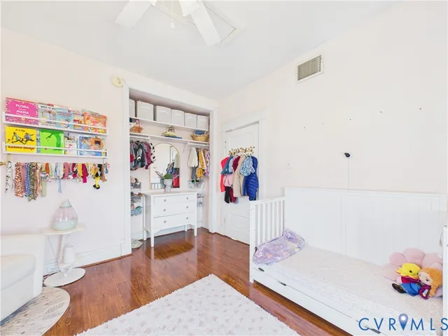 a living room with furniture and flat screen tv