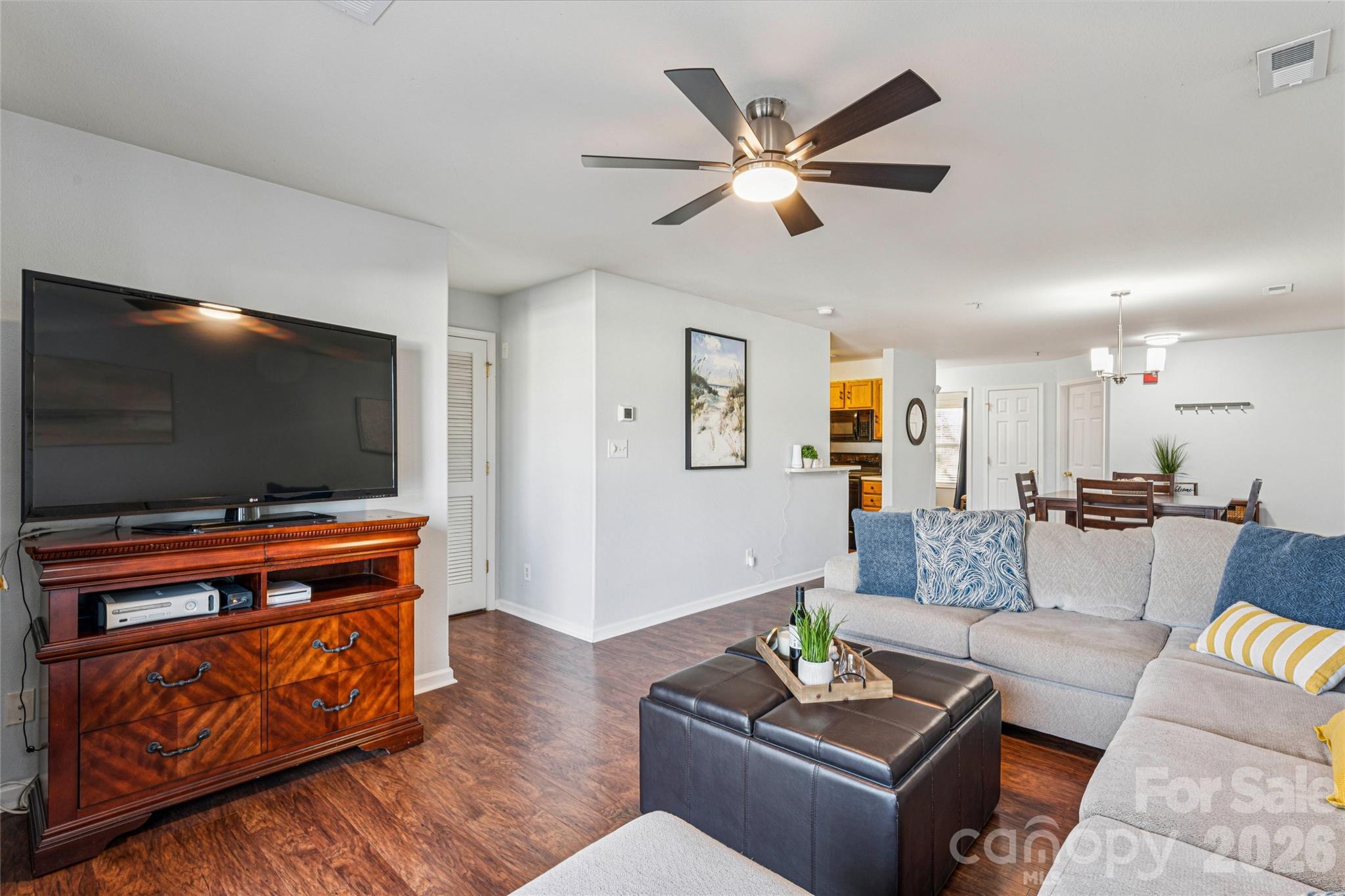 3956 Town Center Road Harrisburg, NC 28075 - Photo 15 of 47 a living room with furniture and a flat screen tv