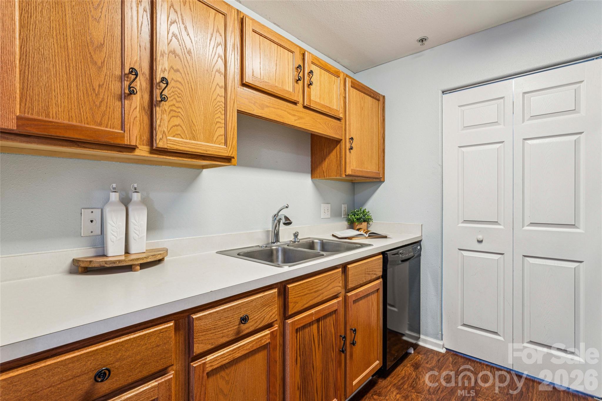 3956 Town Center Road Harrisburg, NC 28075 - Photo 16 of 47 a kitchen with stainless steel appliances granite countertop a sink and cabinets