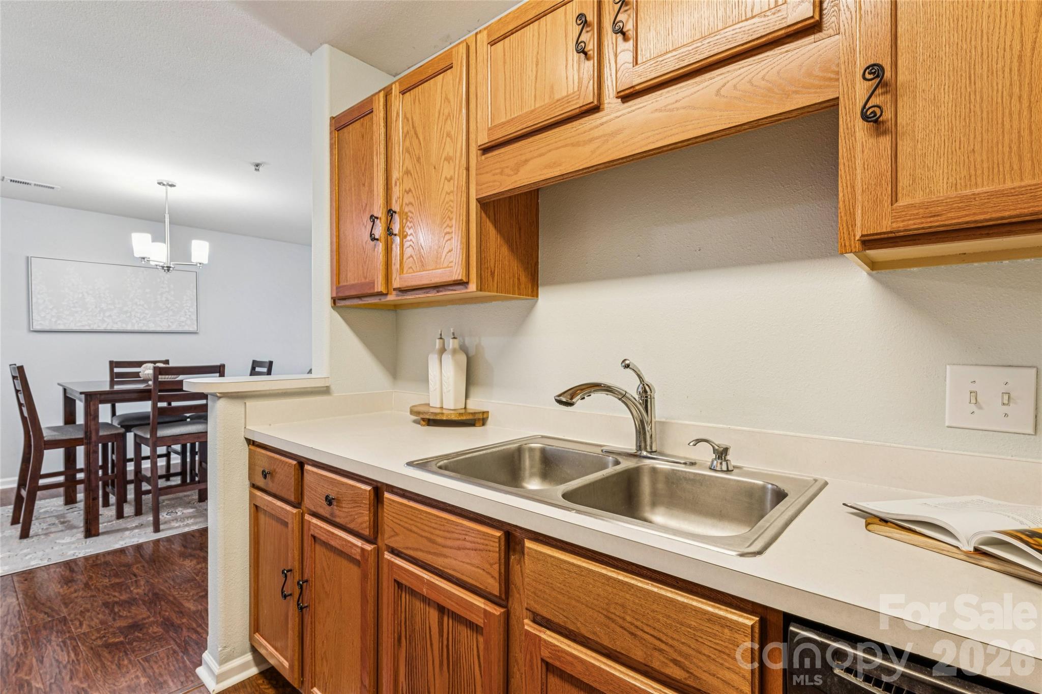 3956 Town Center Road Harrisburg, NC 28075 - Photo 20 of 47 a kitchen with stainless steel appliances granite countertop a sink and cabinets