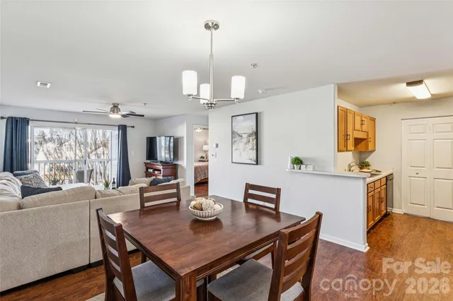 a view of a dining room with furniture window and wooden floor