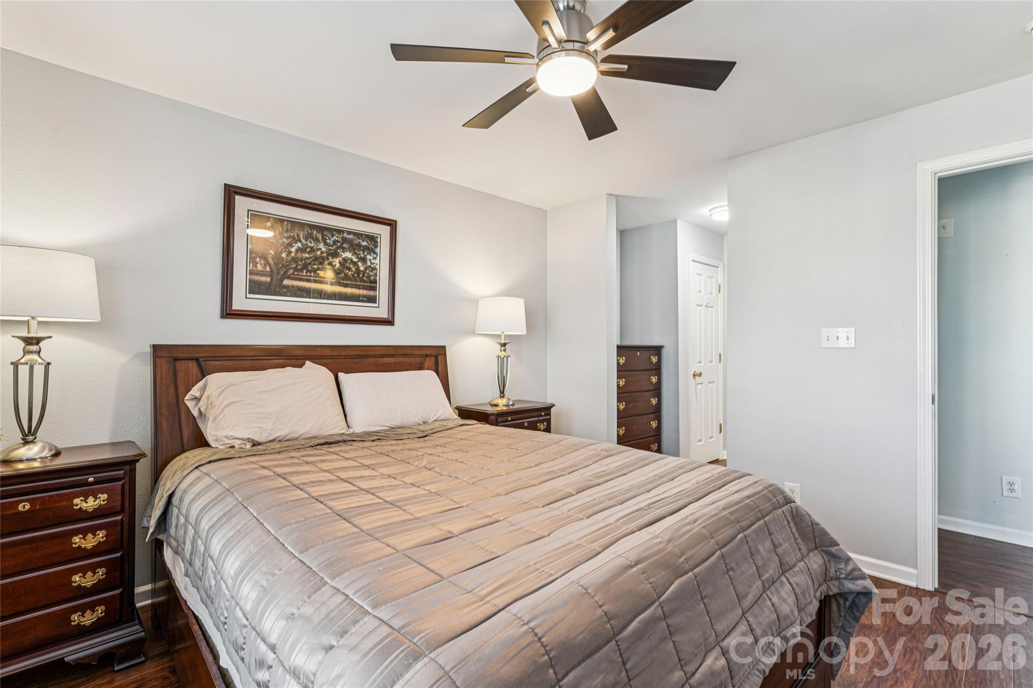 3956 Town Center Road Harrisburg, NC 28075 - Photo 22 of 47 a bedroom with a bed and a painting on the wall