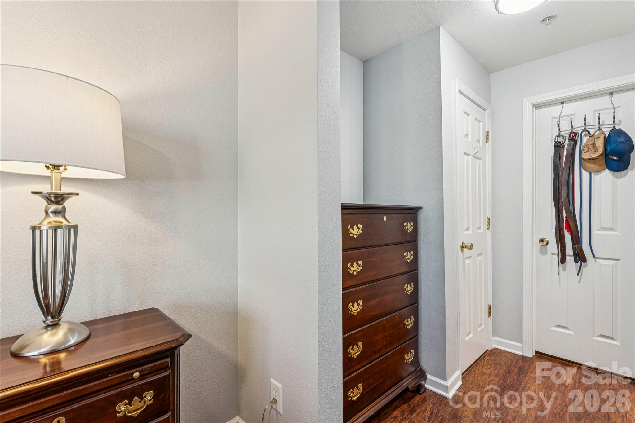 3956 Town Center Road Harrisburg, NC 28075 - Photo 26 of 47 a view of a livingroom with a mirror and a dresser