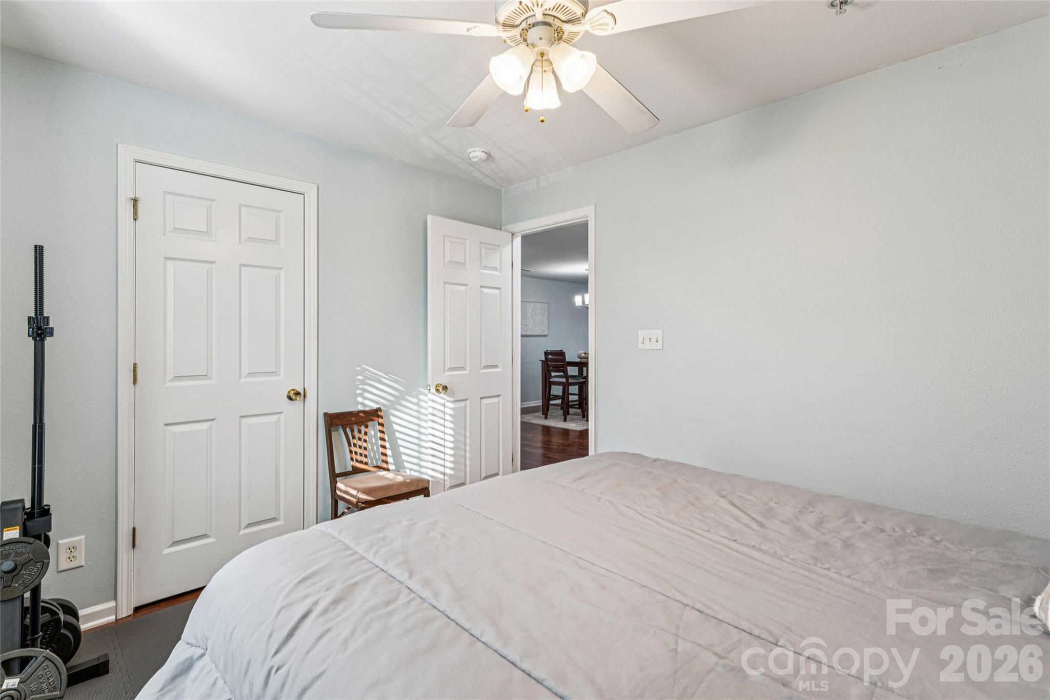 3956 Town Center Road Harrisburg, NC 28075 - Photo 32 of 47 a bedroom with a large bed a chandelier and closet