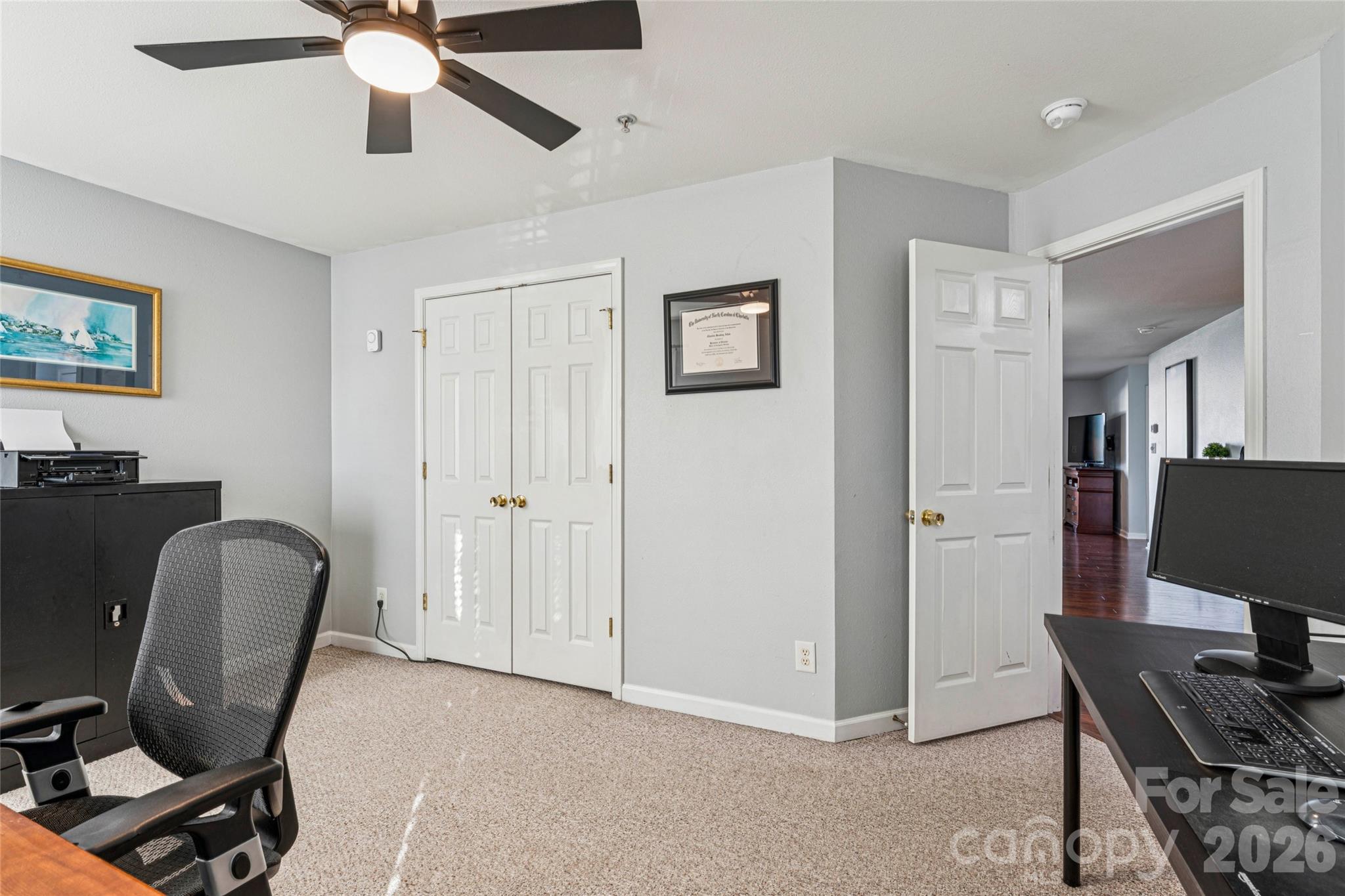 3956 Town Center Road Harrisburg, NC 28075 - Photo 37 of 47 a view of a workspace with furniture and a window