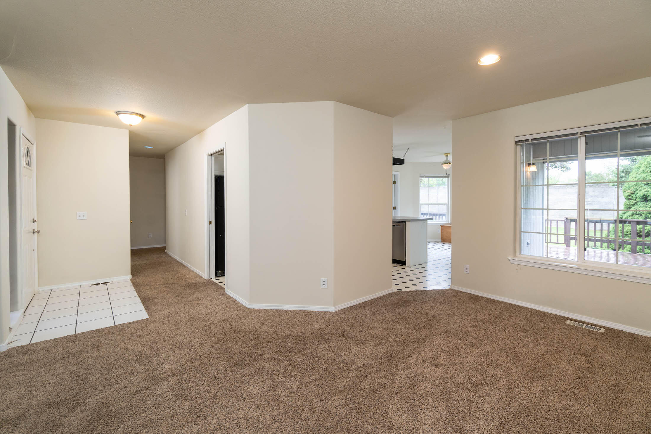 3389 Northeast Stonebrook Loop Bend, OR 97701 - Photo 4 of 27 Living room with hallway to the 3-bedrooms and right to the kitchen.
