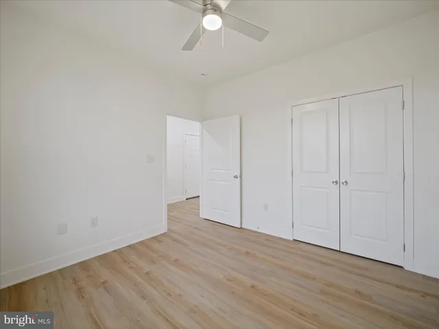 a kitchen with stainless steel appliances granite countertop a table chairs sink and cabinets
