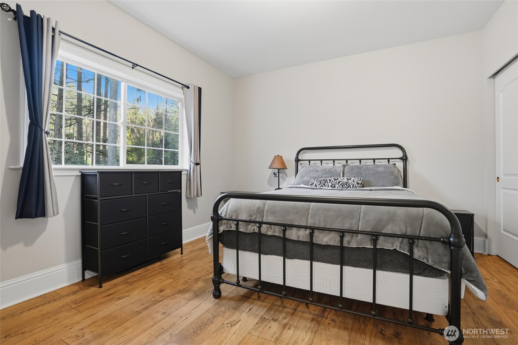 18680 Northwest Hintzville Road Seabeck, WA 98380 - Photo 13 of 40 a bedroom with a bed and a window