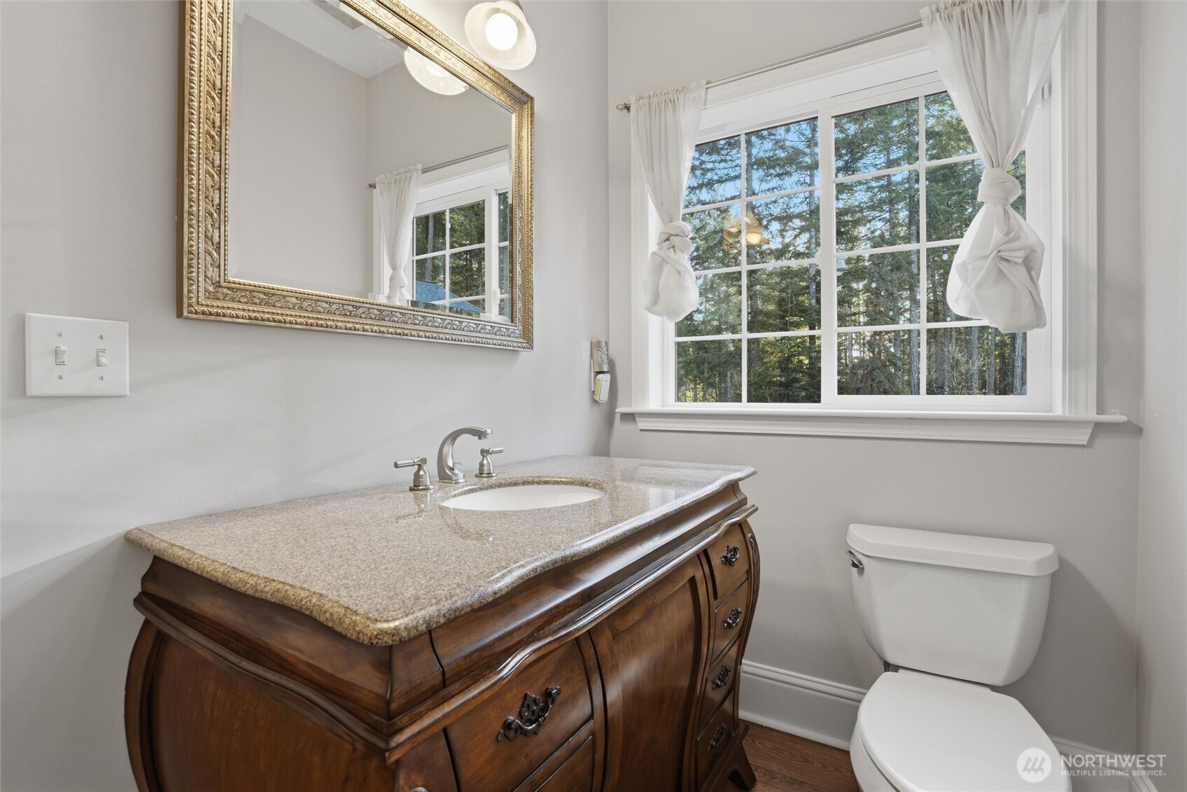 18680 Northwest Hintzville Road Seabeck, WA 98380 - Photo 15 of 40 a bathroom with a sink and a toilet