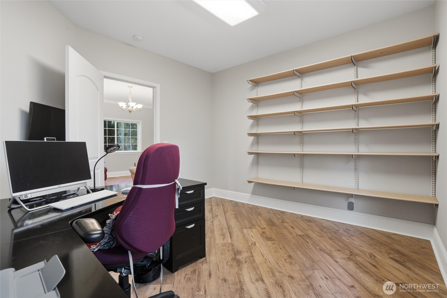 18680 Northwest Hintzville Road Seabeck, WA 98380 - Photo 17 of 40 a workspace with furniture and a flat screen tv