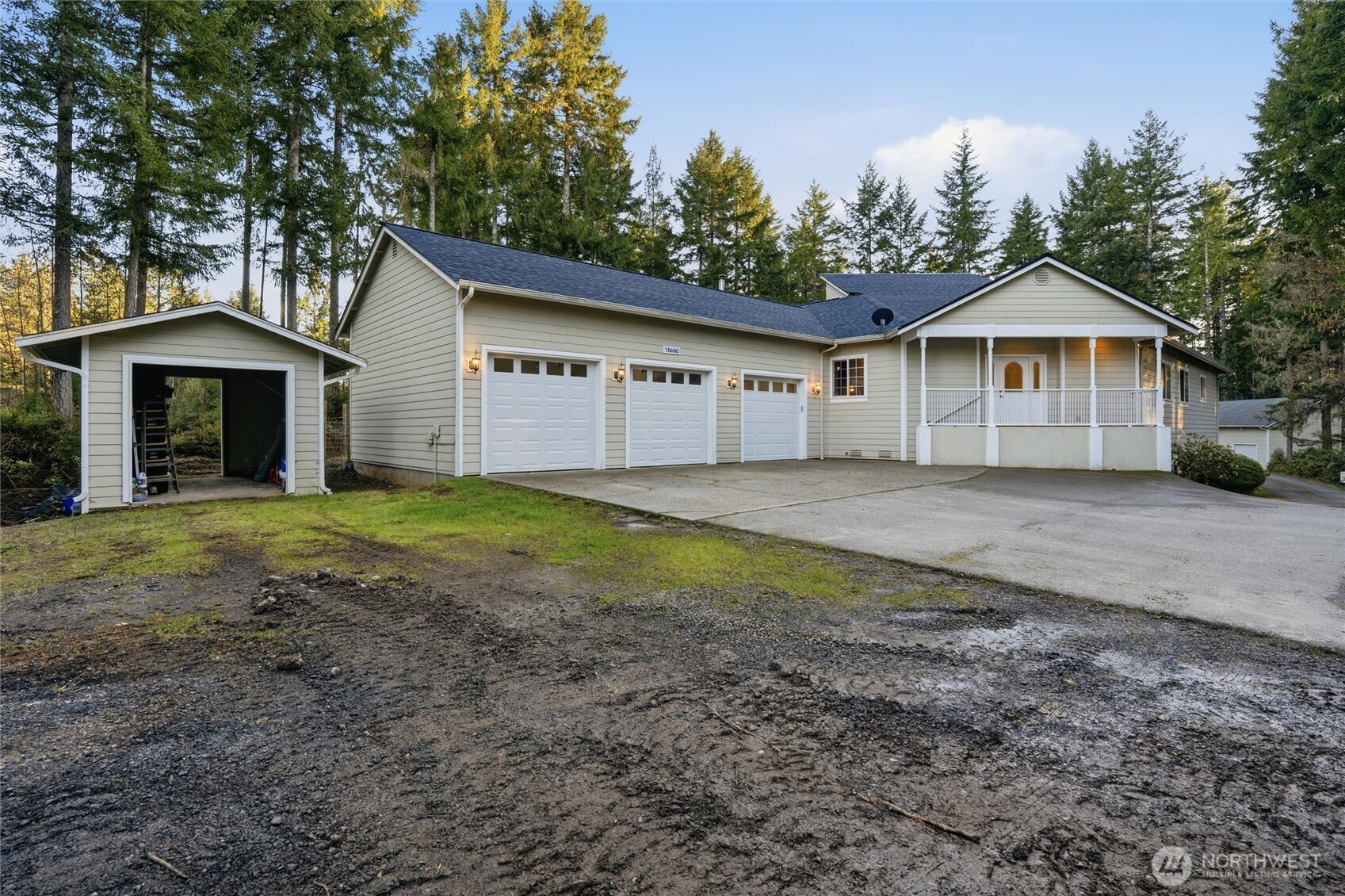 18680 Northwest Hintzville Road Seabeck, WA 98380 - Photo 25 of 40 a view of a house with a yard
