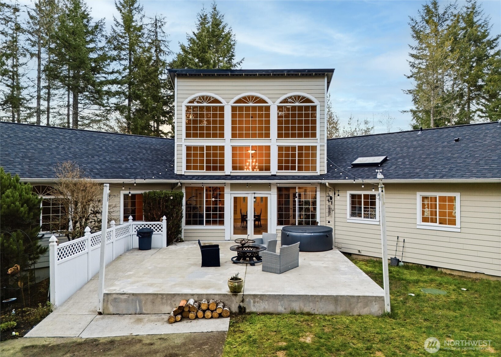 18680 Northwest Hintzville Road Seabeck, WA 98380 - Photo 27 of 40 a front view of a house with porch and sitting area