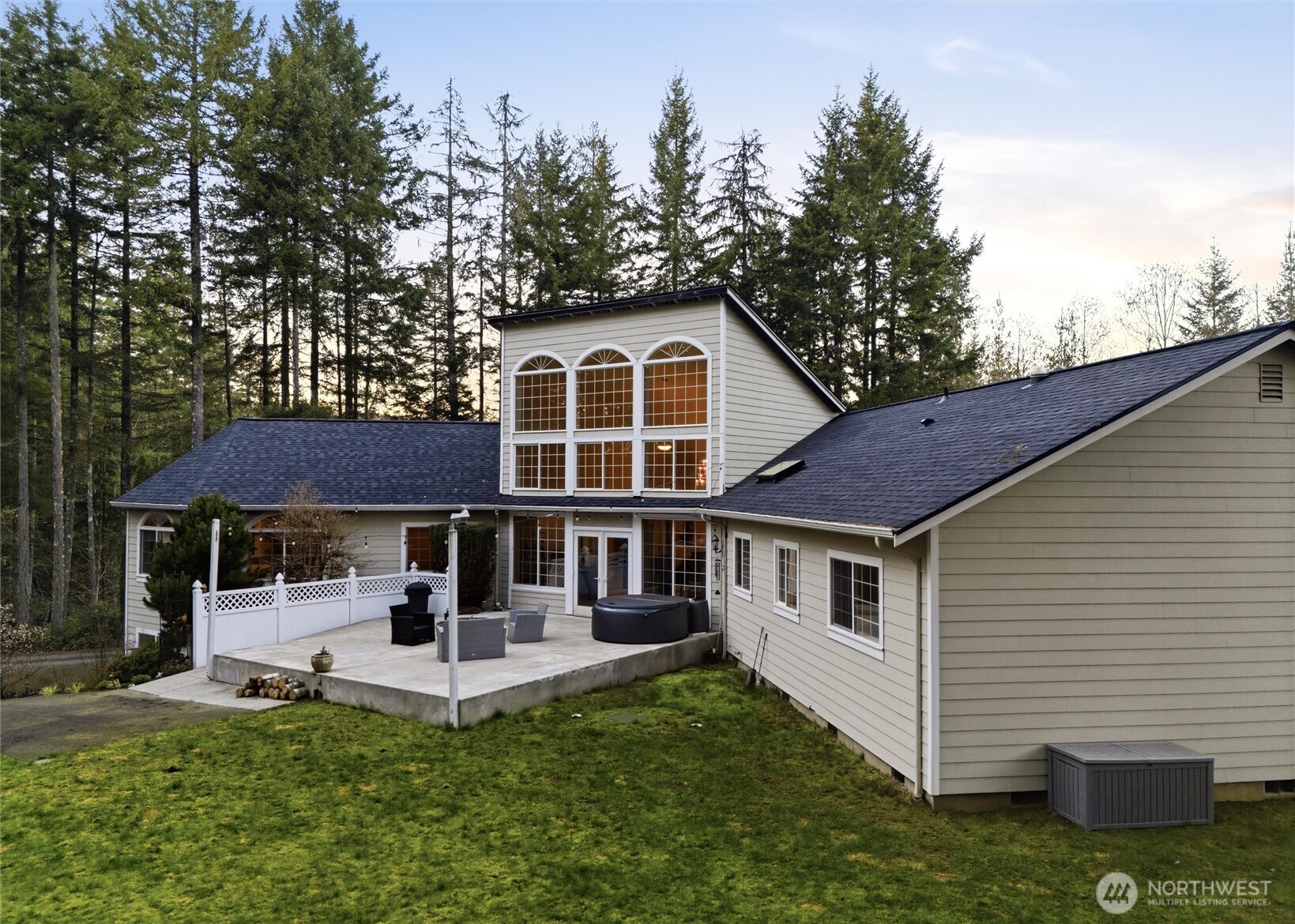 18680 Northwest Hintzville Road Seabeck, WA 98380 - Photo 28 of 40 a front view of a house with a yard table and chairs