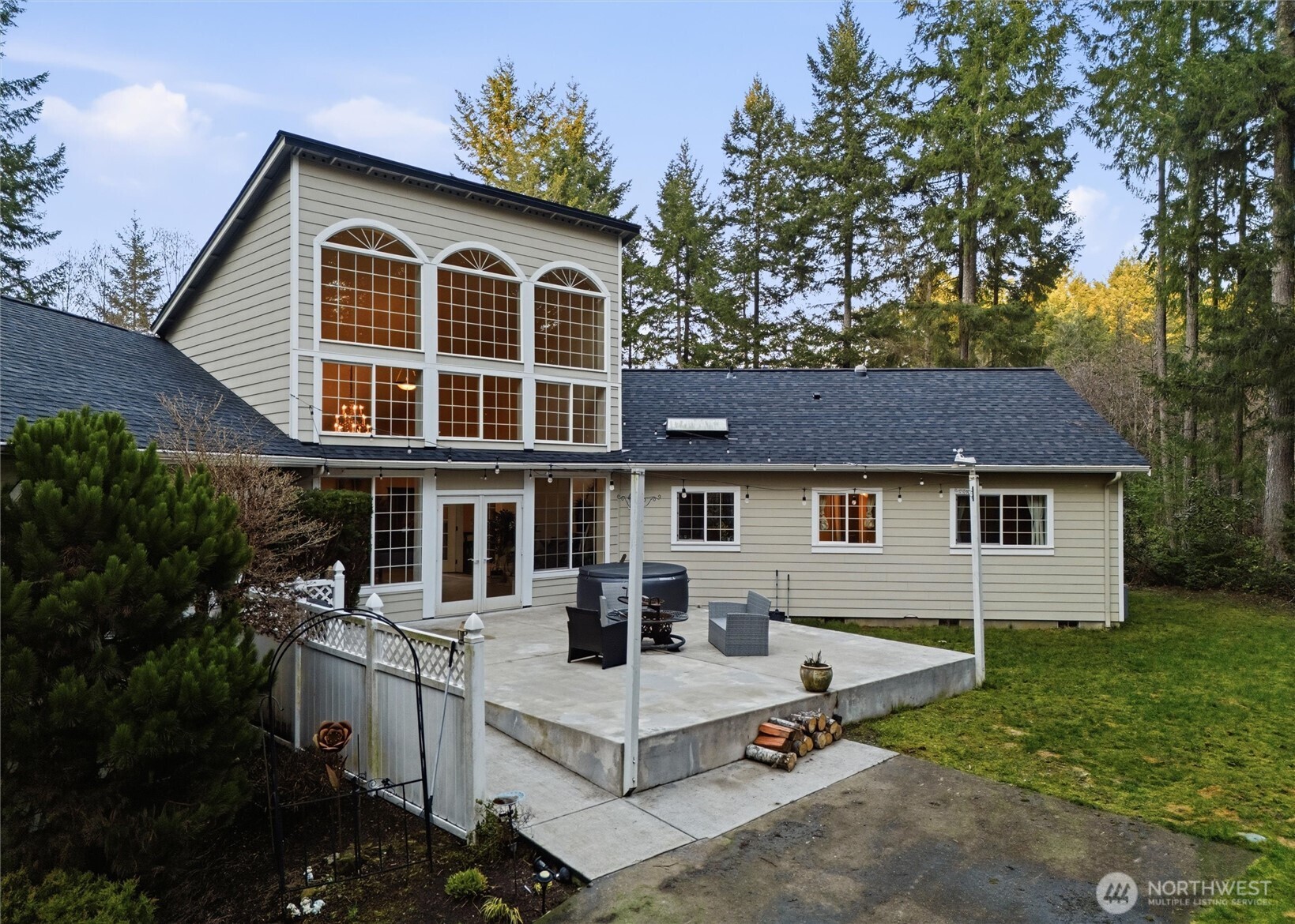 18680 Northwest Hintzville Road Seabeck, WA 98380 - Photo 29 of 40 a view of house and a yard with green space
