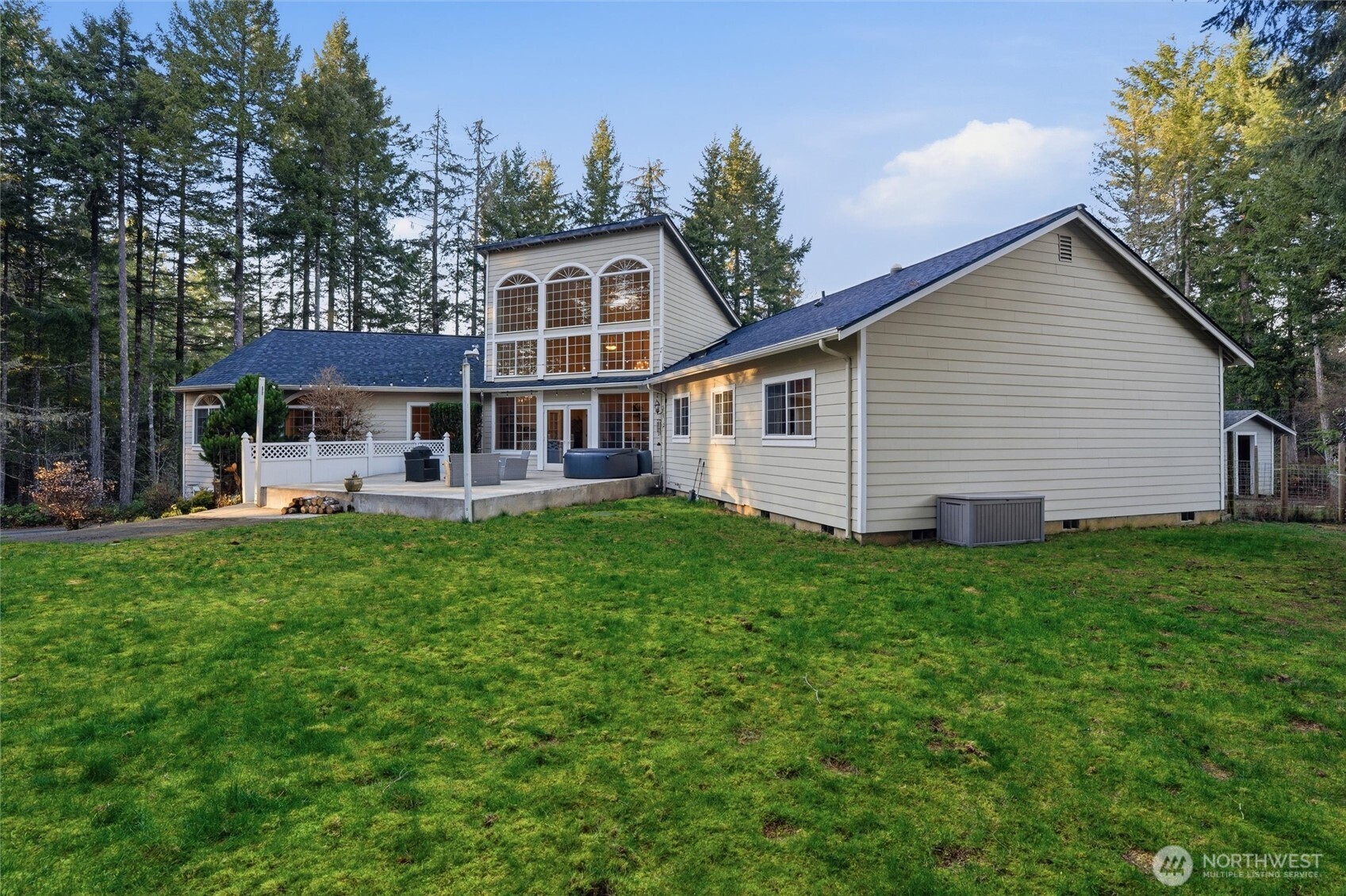 18680 Northwest Hintzville Road Seabeck, WA 98380 - Photo 30 of 40 a front view of house with yard and green space