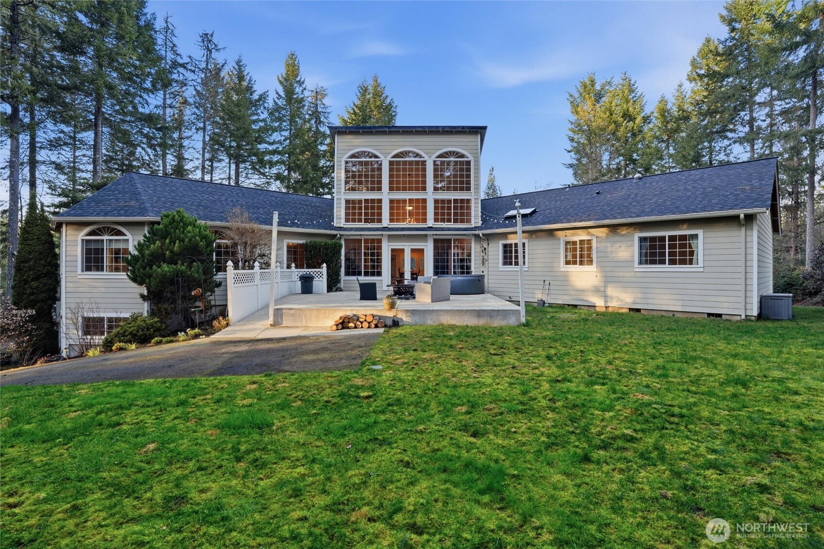 18680 Northwest Hintzville Road Seabeck, WA 98380 - Photo 31 of 40 a view of a house with a swimming pool