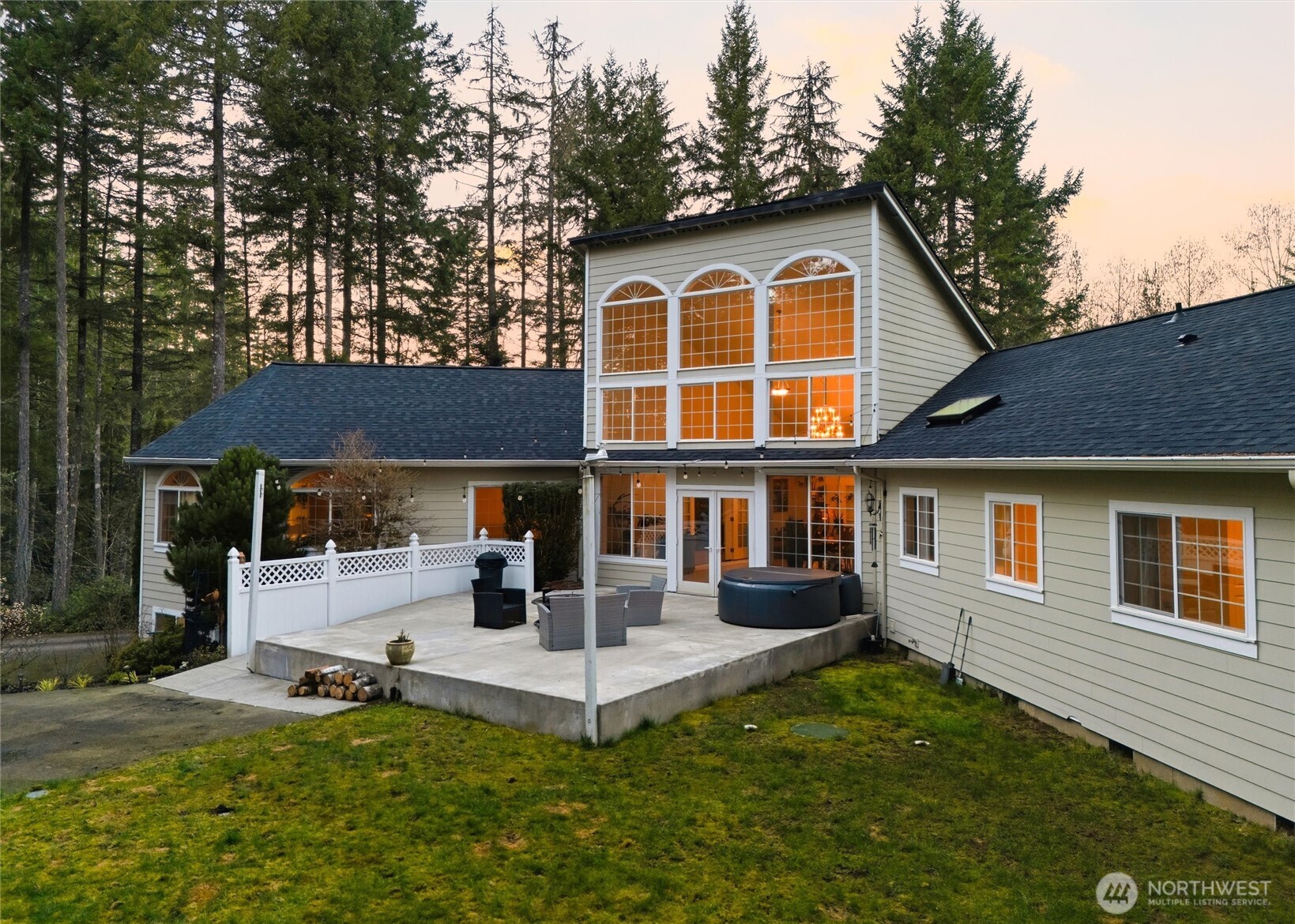 18680 Northwest Hintzville Road Seabeck, WA 98380 - Photo 33 of 40 a front view of a house with a yard
