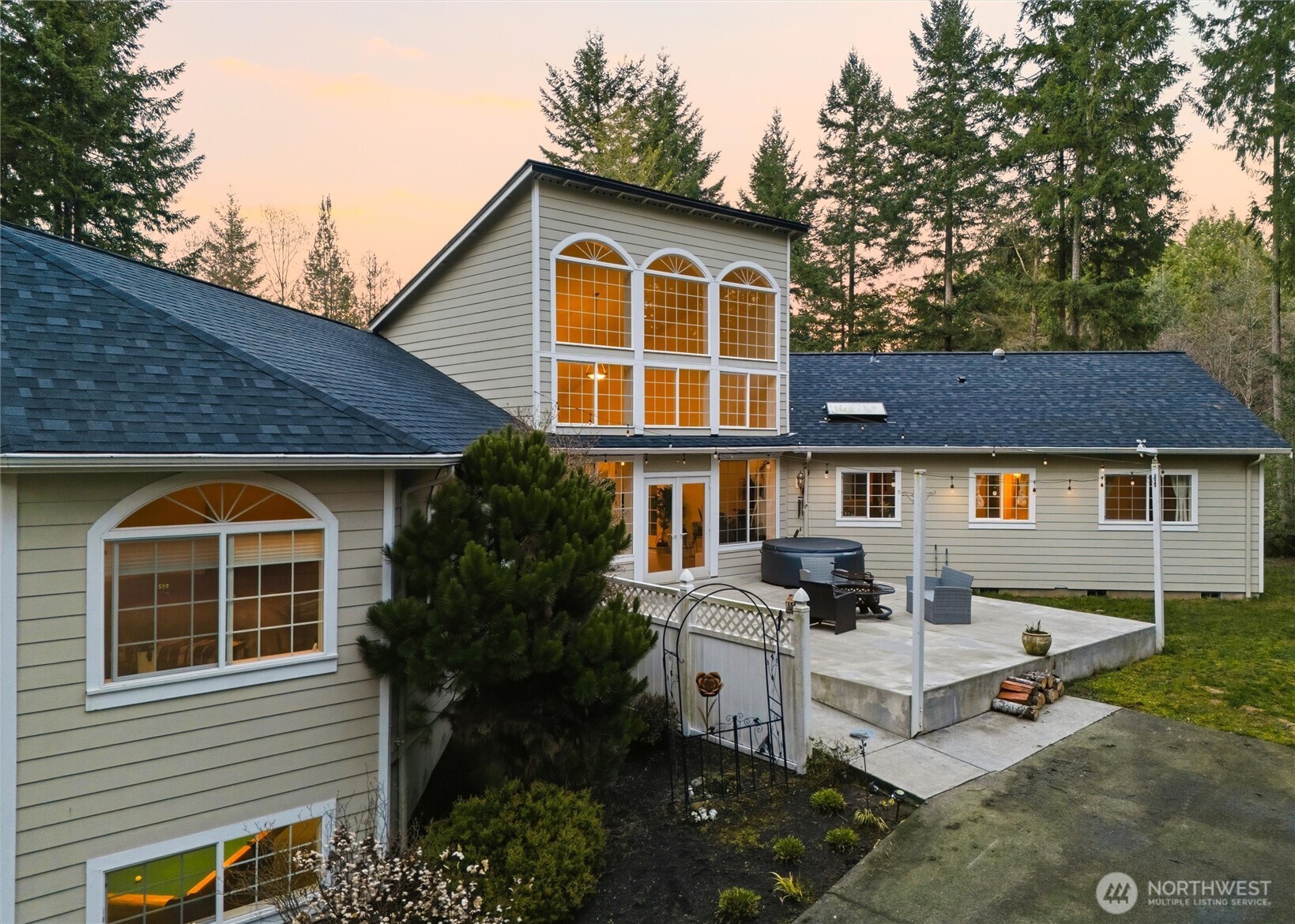 18680 Northwest Hintzville Road Seabeck, WA 98380 - Photo 35 of 40 a view of a house with backyard and sitting area