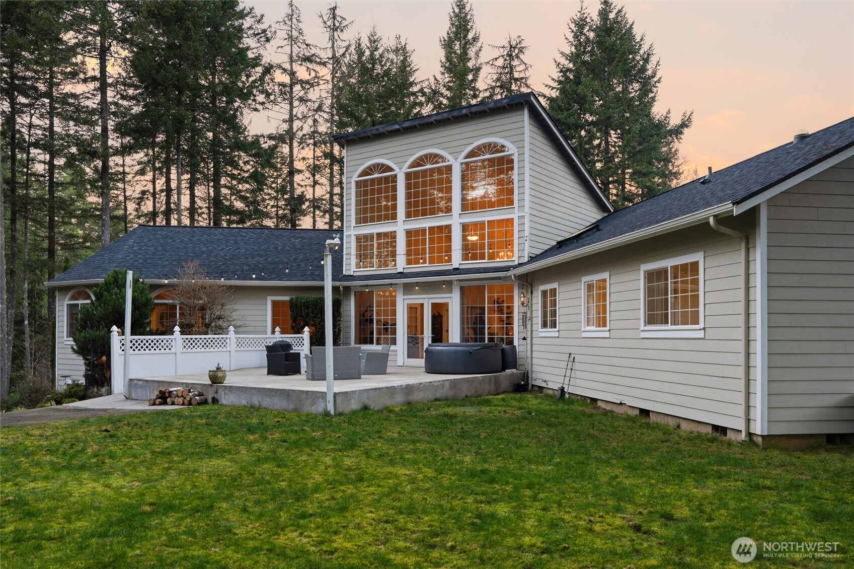 18680 Northwest Hintzville Road Seabeck, WA 98380 - Photo 36 of 40 a front view of a house with a yard