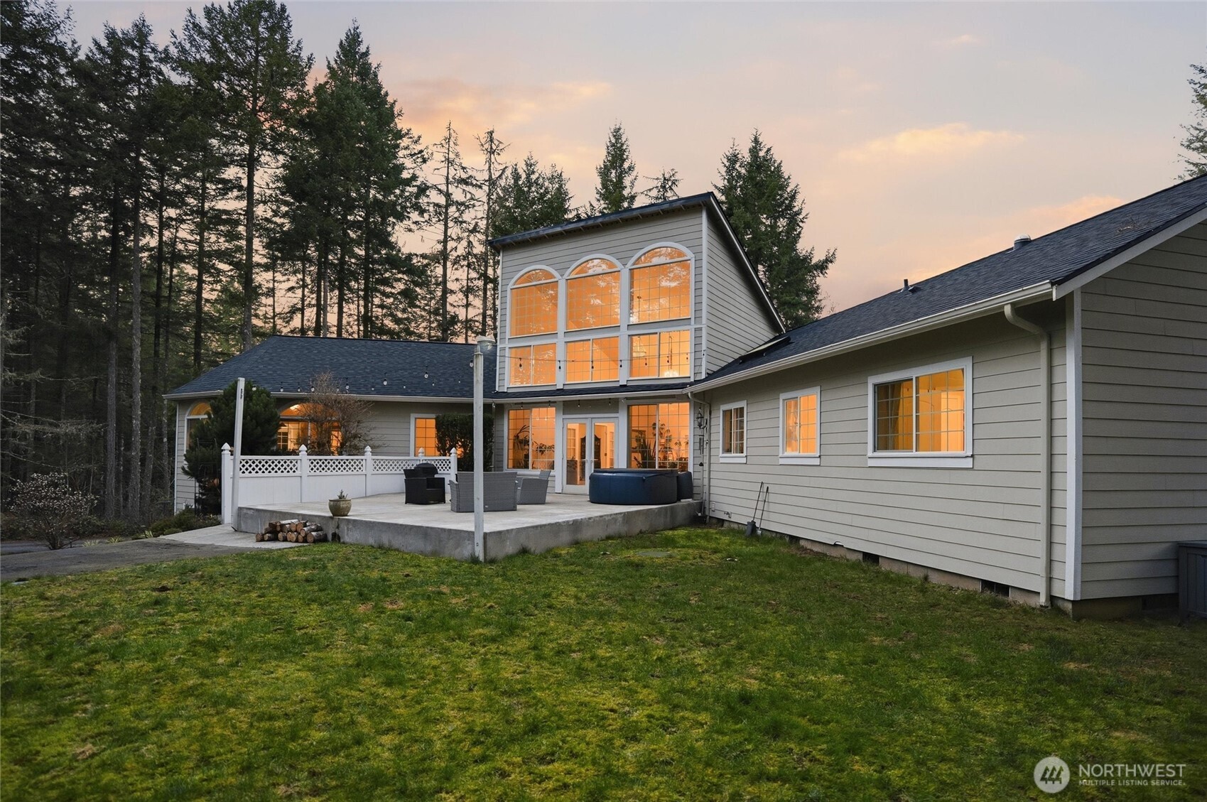 18680 Northwest Hintzville Road Seabeck, WA 98380 - Photo 37 of 40 a front view of a house with a yard