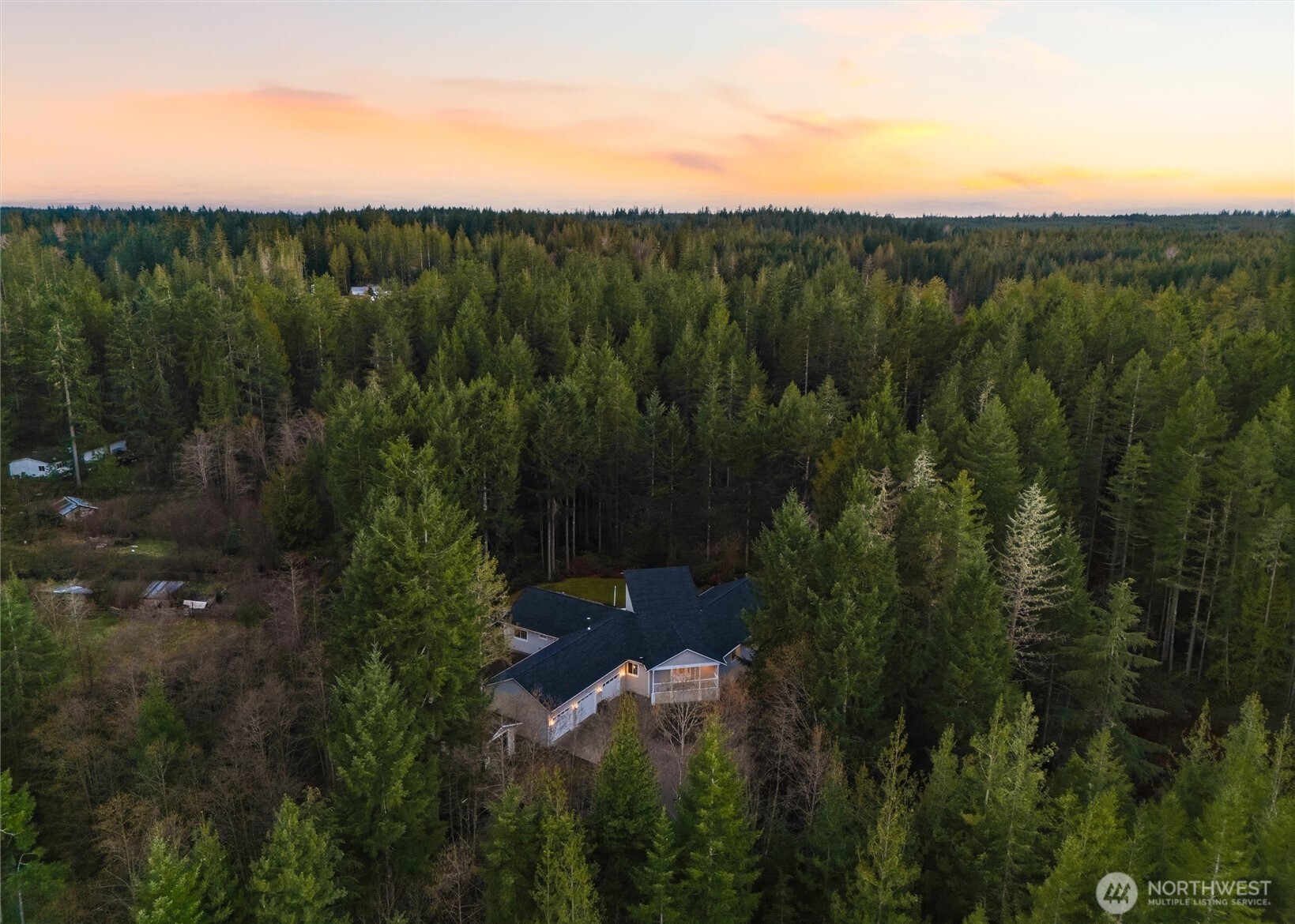 18680 Northwest Hintzville Road Seabeck, WA 98380 - Photo 38 of 40 a view of a city with lush green forest