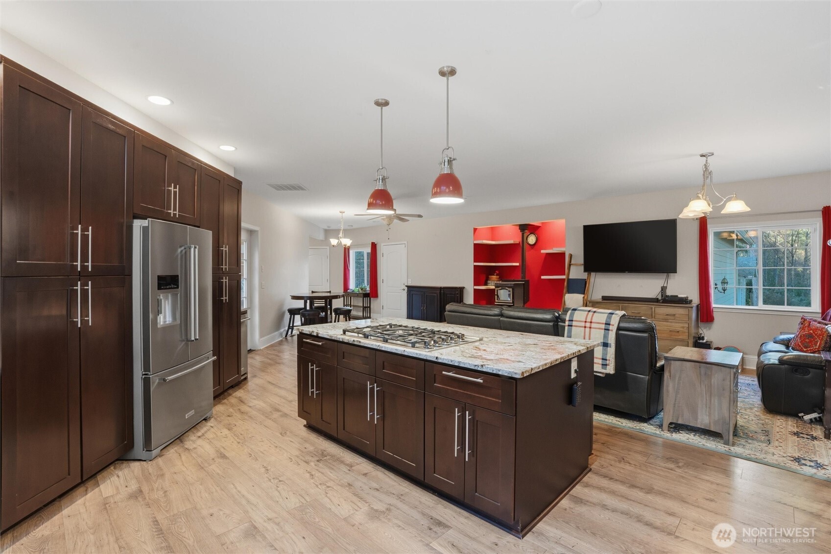18680 Northwest Hintzville Road Seabeck, WA 98380 - Photo 10 of 40 a kitchen with stainless steel appliances granite countertop a stove and a refrigerator