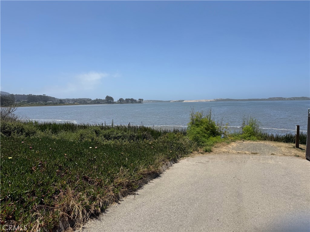 0 3rd Street Los Osos, CA 93402 - Photo 4 of 13 a view of a lake with beach and mountain in the back