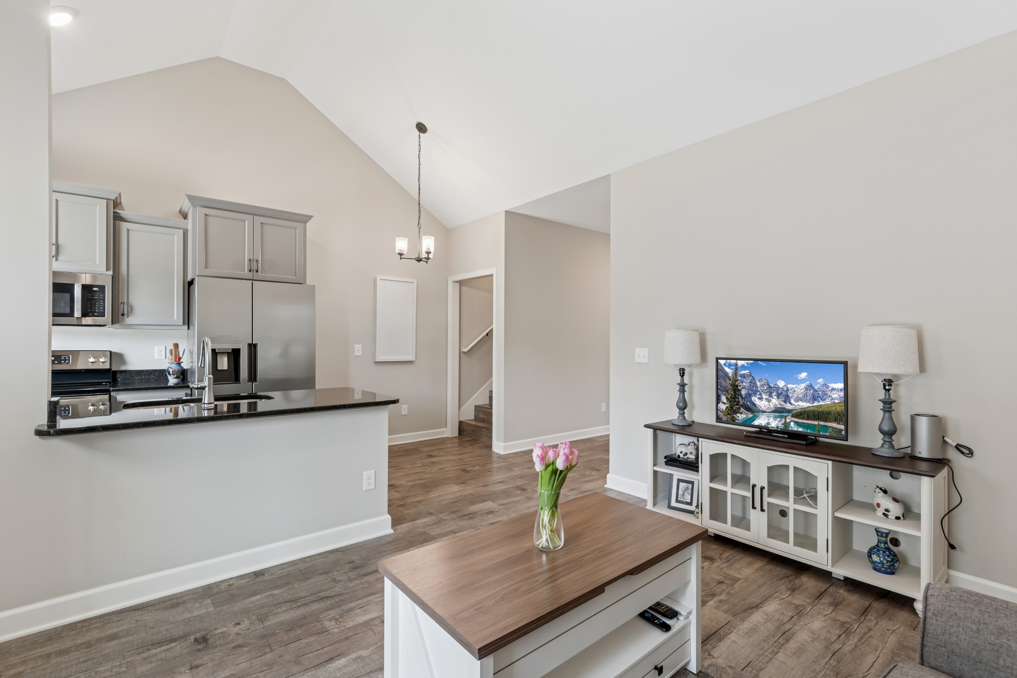 114 Eno Road Dickson, TN 37055 - Photo 6 of 25 a kitchen with stainless steel appliances granite countertop a sink cabinets and wooden floor