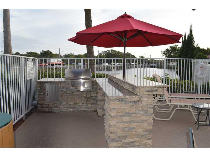 151 Southwest 96th Terrace, Unit 151 Plantation, FL 33324 - Photo 28 of 28 Summer Kitchen. Grill at community pool