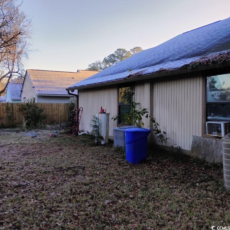 156 Lancashire Road Summerville, SC 29486 - Photo 2 of 2 Property exterior at dusk with roof with shingles and cooling unit