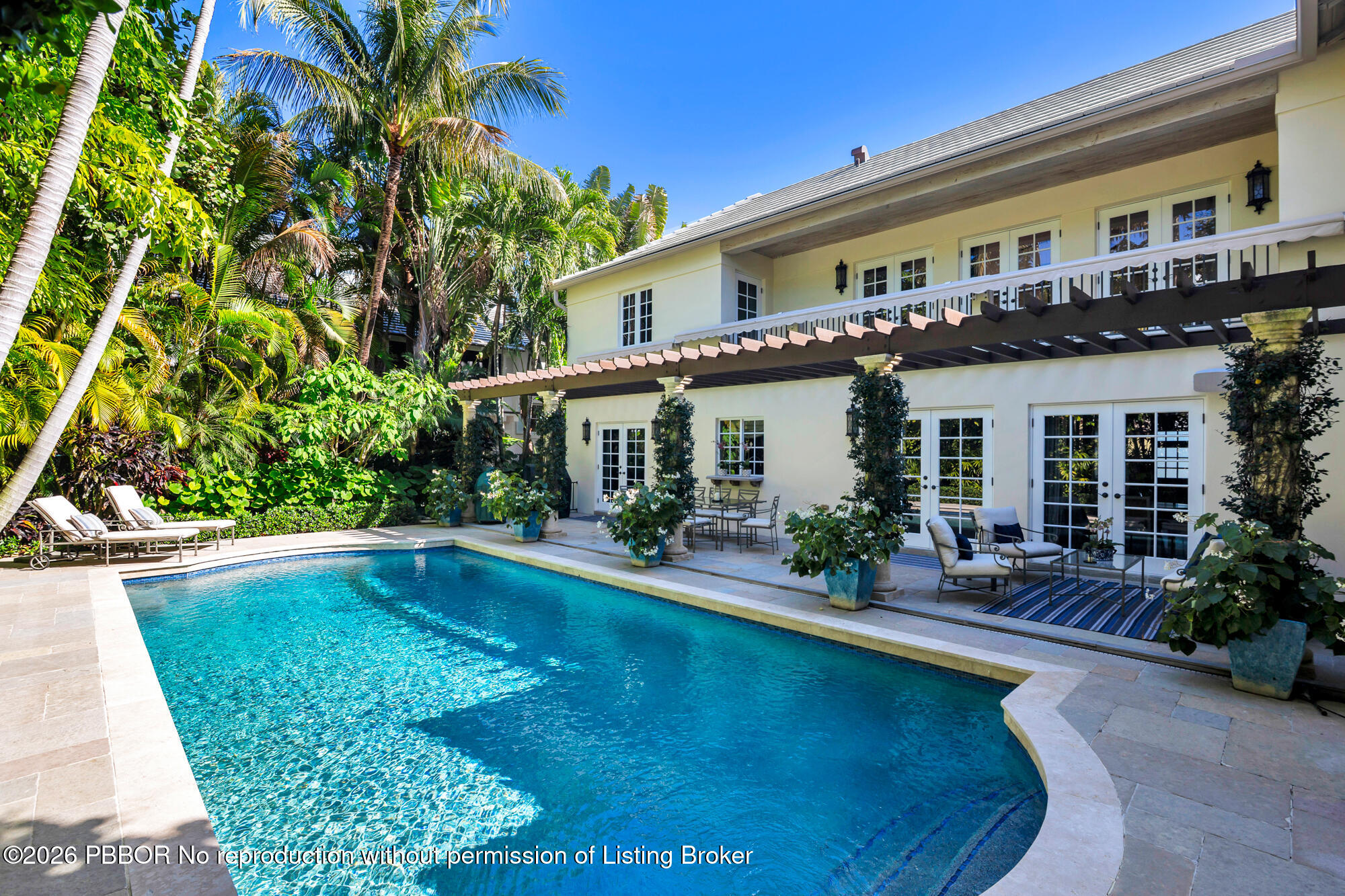 111 Seagate Road Palm Beach, FL 33480 - Photo 2 of 35 a view of a house with swimming pool patio and a garden