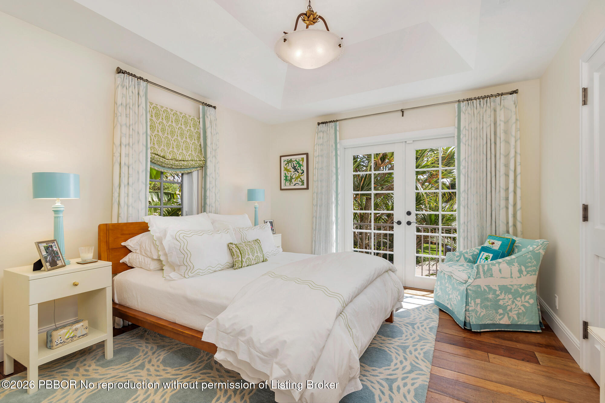 111 Seagate Road Palm Beach, FL 33480 - Photo 21 of 35 a bedroom with a bed and windows