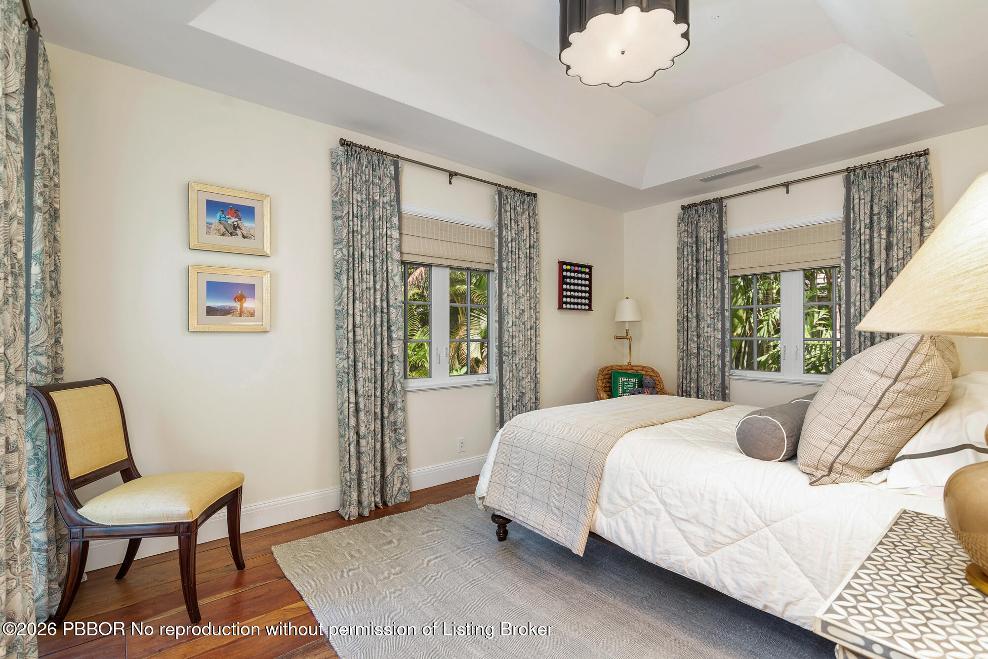 111 Seagate Road Palm Beach, FL 33480 - Photo 22 of 35 a bedroom with a bed and a chair