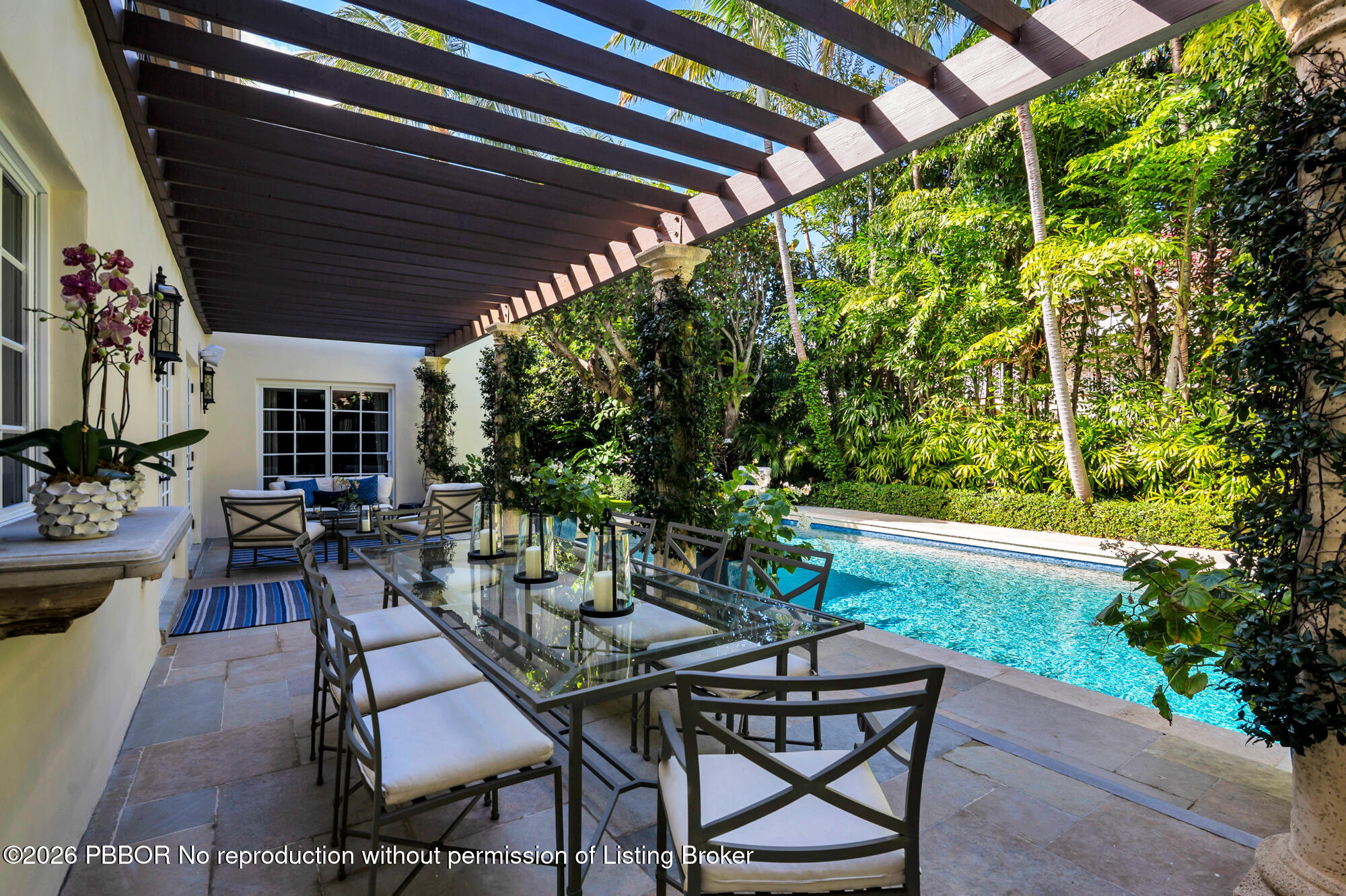 111 Seagate Road Palm Beach, FL 33480 - Photo 28 of 35 a view of an outdoor space with a table and chairs in patio