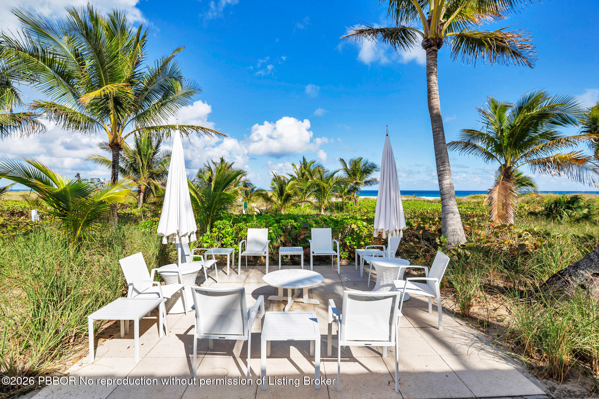 111 Seagate Road Palm Beach, FL 33480 - Photo 29 of 35 a view of an outdoor sitting area with swimming pool