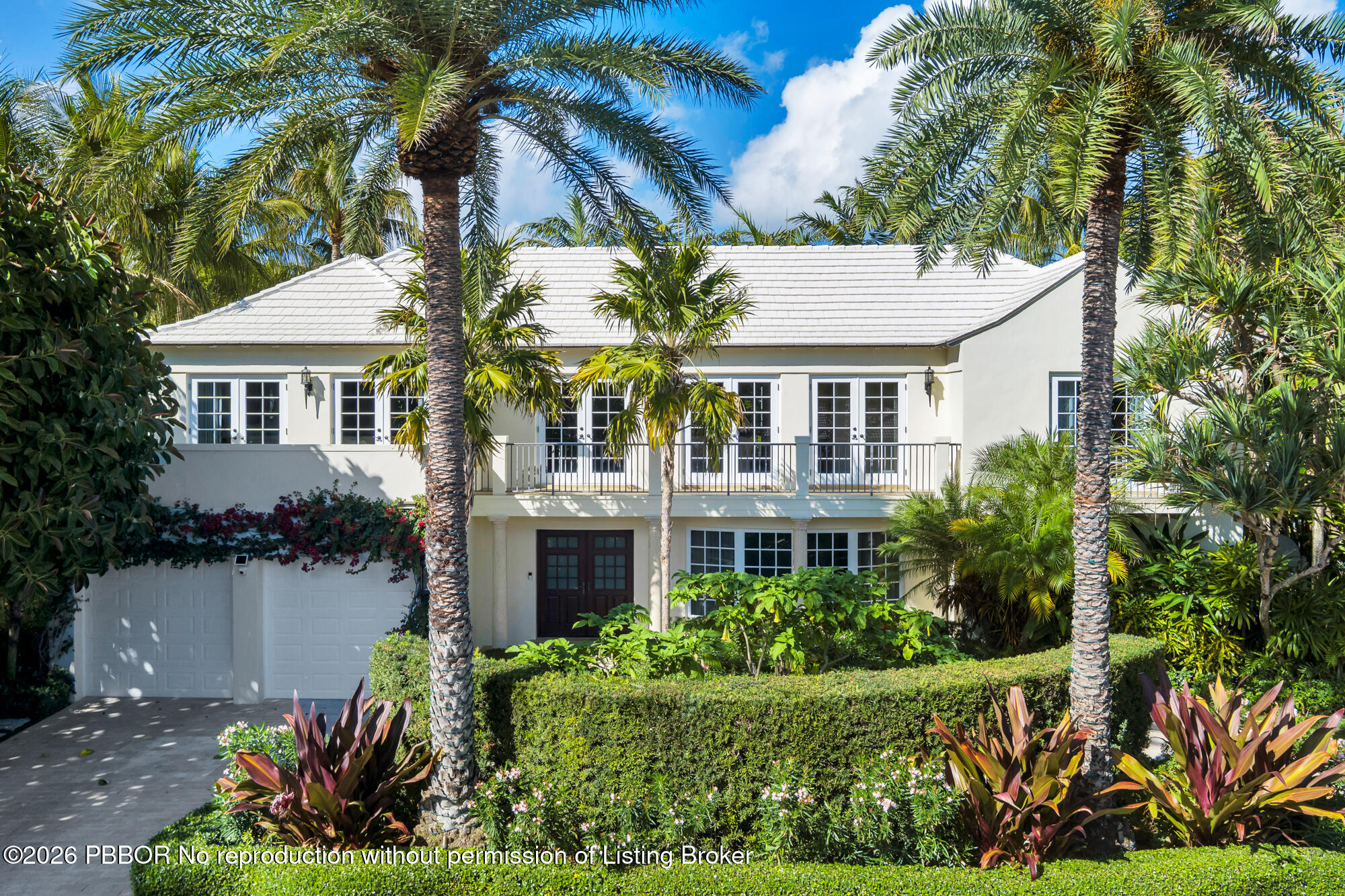 111 Seagate Road Palm Beach, FL 33480 - Photo 3 of 35 a front view of a house with a yard and potted plants