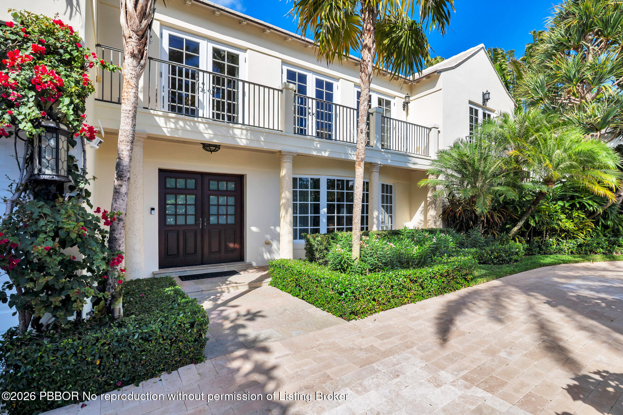 111 Seagate Road Palm Beach, FL 33480 - Photo 4 of 35 a view of a building with a yard and potted plants