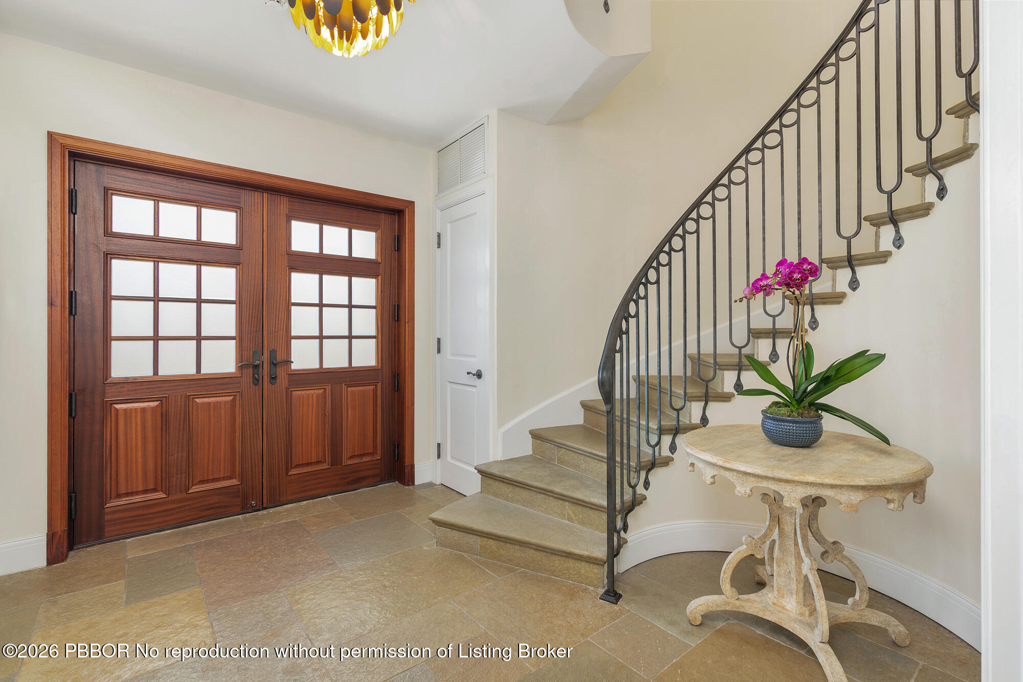 111 Seagate Road Palm Beach, FL 33480 - Photo 5 of 35 a view of entryway with wooden door and stairs