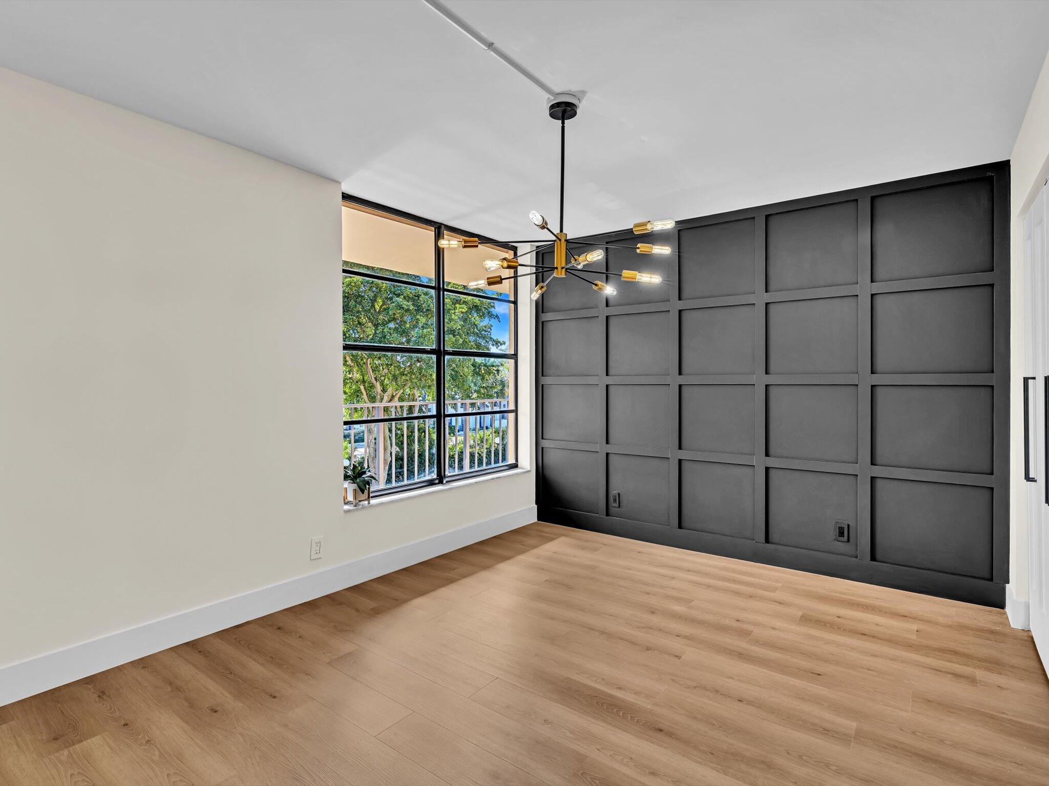 21 Royal Palm Way, Unit 303 Boca Raton, FL 33432 - Photo 23 of 38 a view of a room with window and chandelier fan
