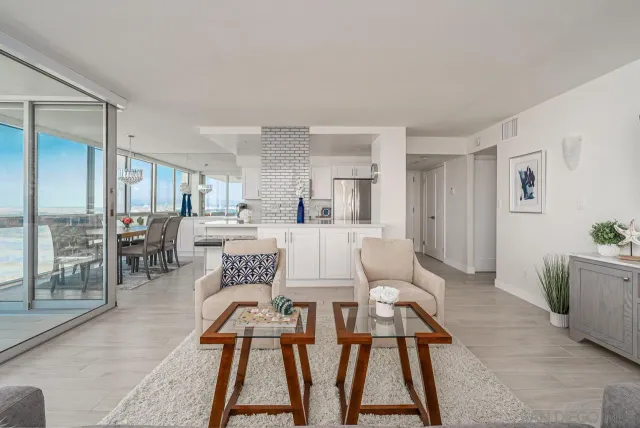 a view of a dining room with furniture and a rug
