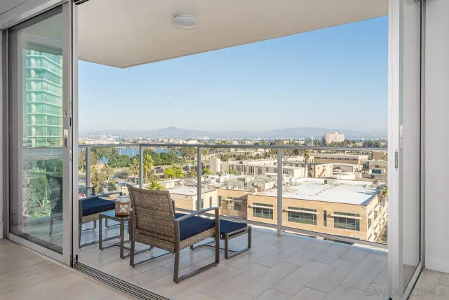 a view of a balcony with chairs