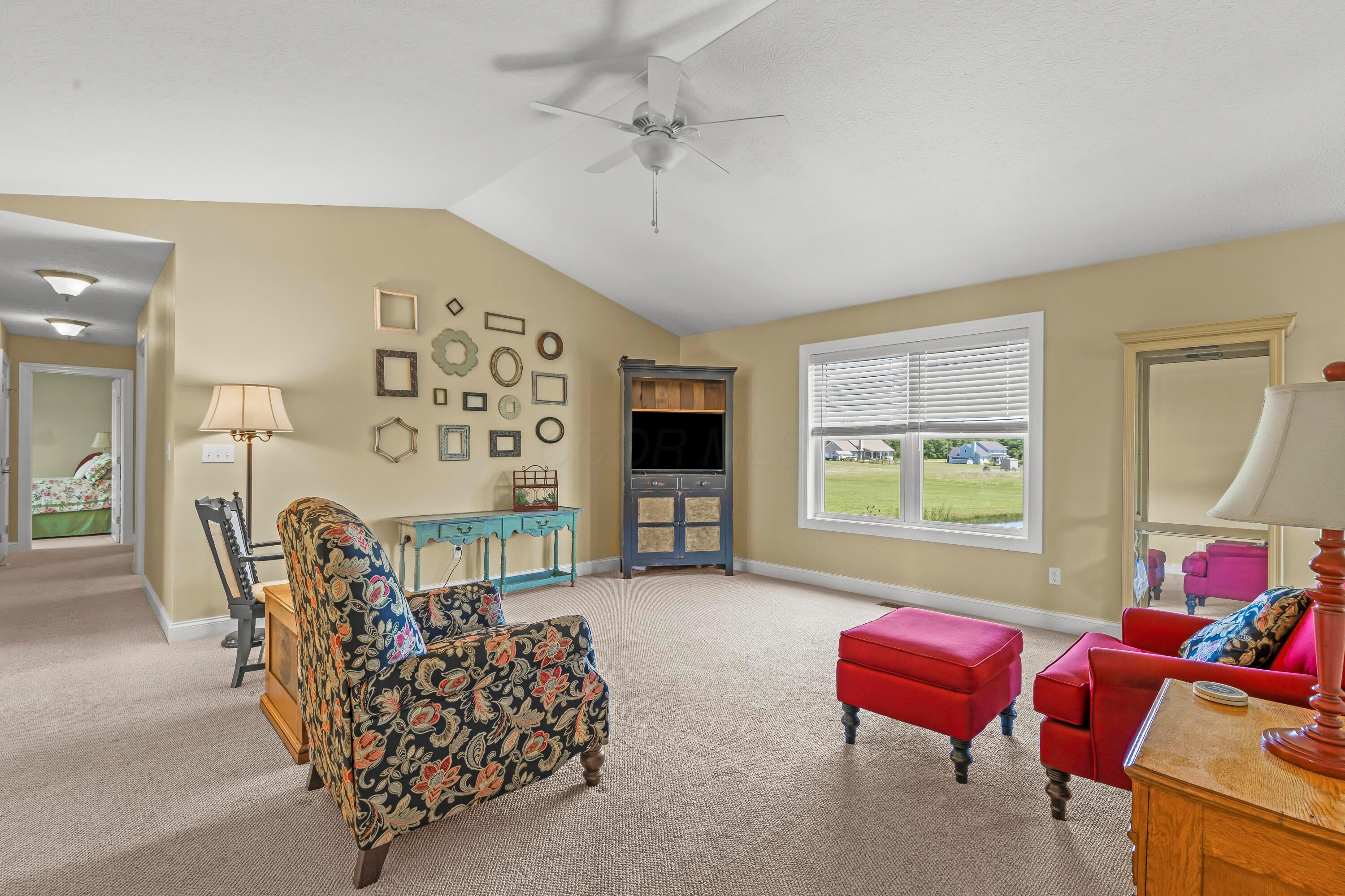 3582 Panhandle Road Delaware, OH 43015 - Photo 24 of 65 • Berber carpet • Tan painted walls • Lighted ceiling fan • Cathedral ceiling
