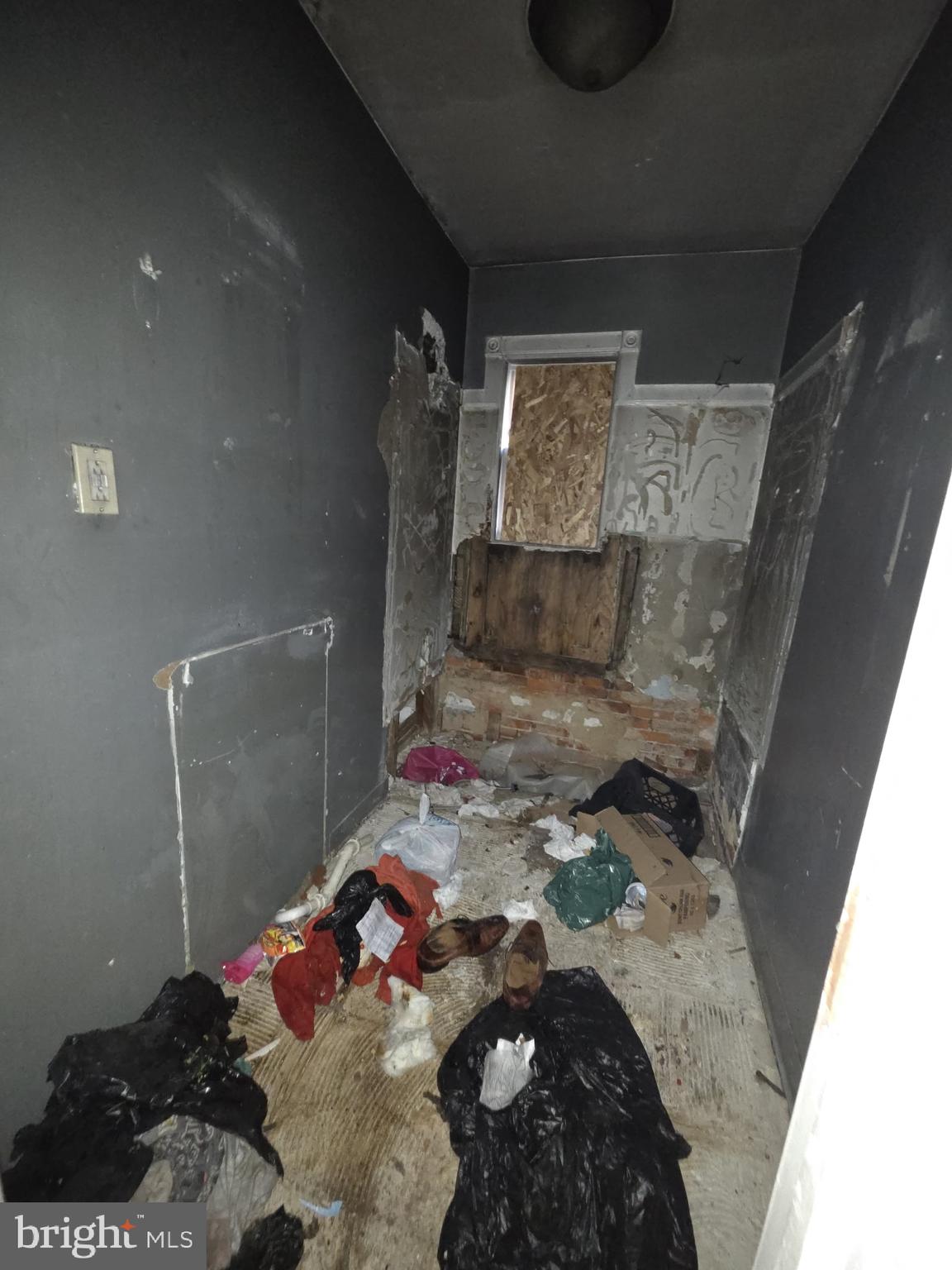 610 West 8th Street Chester, PA 19013 - Photo 6 of 15 a bed room with a bed and a couch