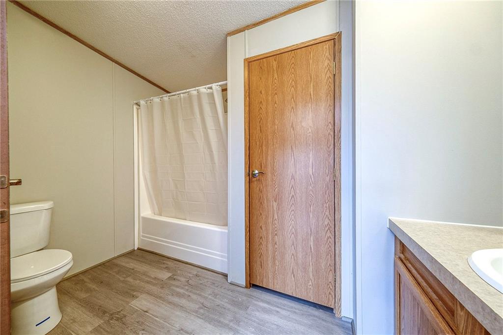 3454 Evergreen Road Pittsburgh, PA 15237 - Photo 19 of 25 a bathroom with a granite countertop sink a toilet and shower