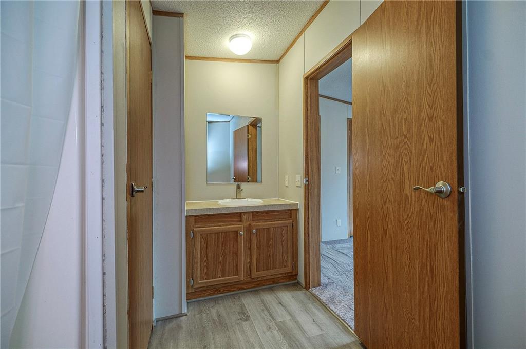 3454 Evergreen Road Pittsburgh, PA 15237 - Photo 21 of 25 a bathroom with a mirror and a sink